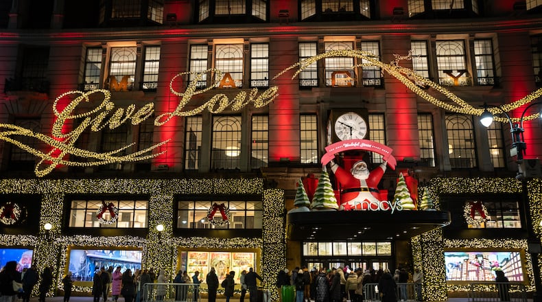 Black Friday Shoppers wait in line to enter Macy's flagship store on Friday, Nov. 28, 2025 in New York. (AP Photo/Angelina Katsanis)