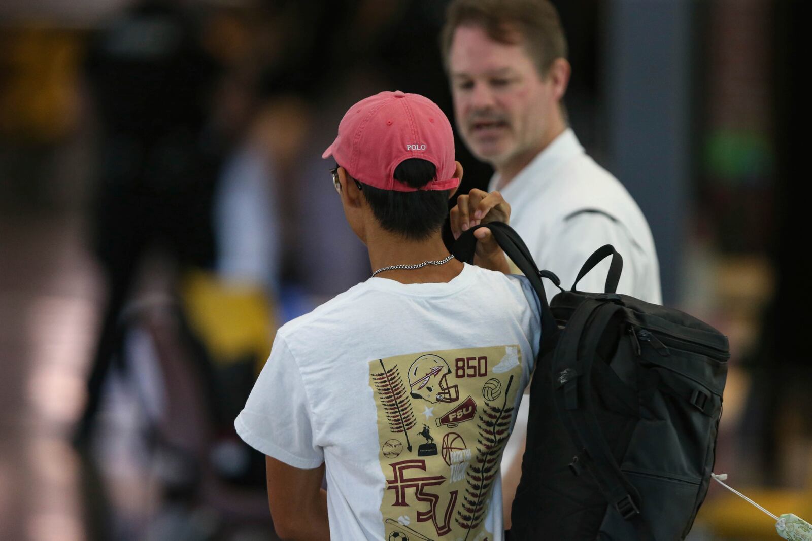 Student Ethan Cheng retrieves his sunglasses, computer and backpack that he left inside the Florida State Student Union building at the time of the shooting, in Tallahassee, Fla., Friday, April 18, 2025. (AP Photo/Gary McCullough)