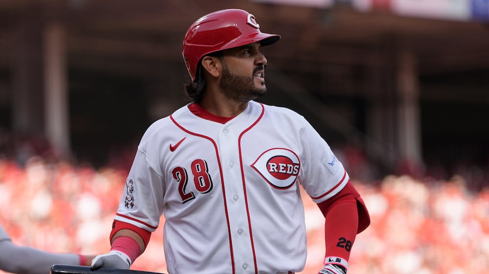 Cincinnati Reds third baseman Eugenio Suárez reacts after striking out during the sixth inning of an opening-day baseball game against the Boston Red Sox in Cincinnati, Thursday, March 26, 2026. (AP Photo/Carolyn Kaster)