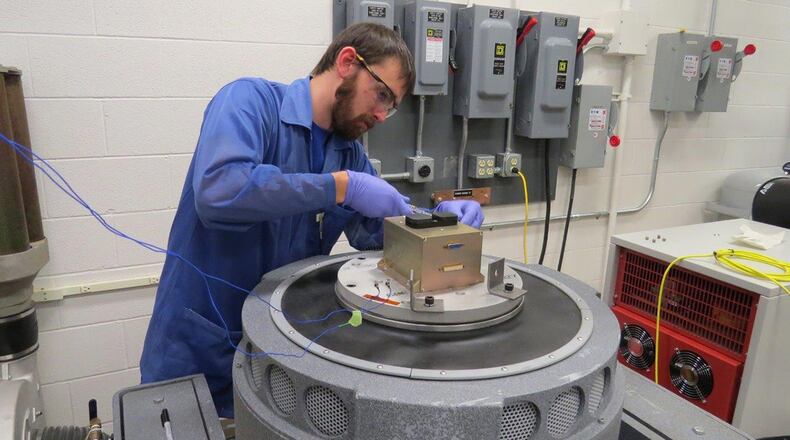 Chris Sheffield, laboratory technician for the Air Force Institute of Technology Center for Space Research and Assurance, conducts testing on AFIT’s Space Object Self-Tracker. The SOS is a self-sufficient, low-cost, low-weight and low-power experimental payload designed to demonstrate precise tracking capabilities for future Space Situational Awareness and Space Traffic Management. (Contributed photo)