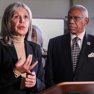 A Dayton Daily News file photo of former Dayton City Commission candidate Karen Wick talking while mayor Jeffrey Mims Jr. listens during an early voting rally on Oct. 7, 2025 outside Montgomery County Board of Elections in downtown Dayton. Wick died Saturday, Dec. 6, 2025. BRYANT BILLING / STAFF