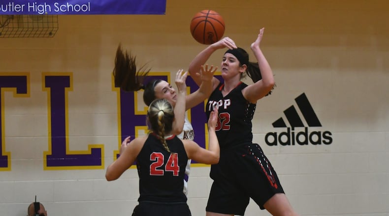 Tipp’s Katie Hemmelgarn (right) battles Butler’s Emily Ledbetter (middle) for a rebound as Tipp’s Kendall Clodfelter defends. Greg Billing / Contributed