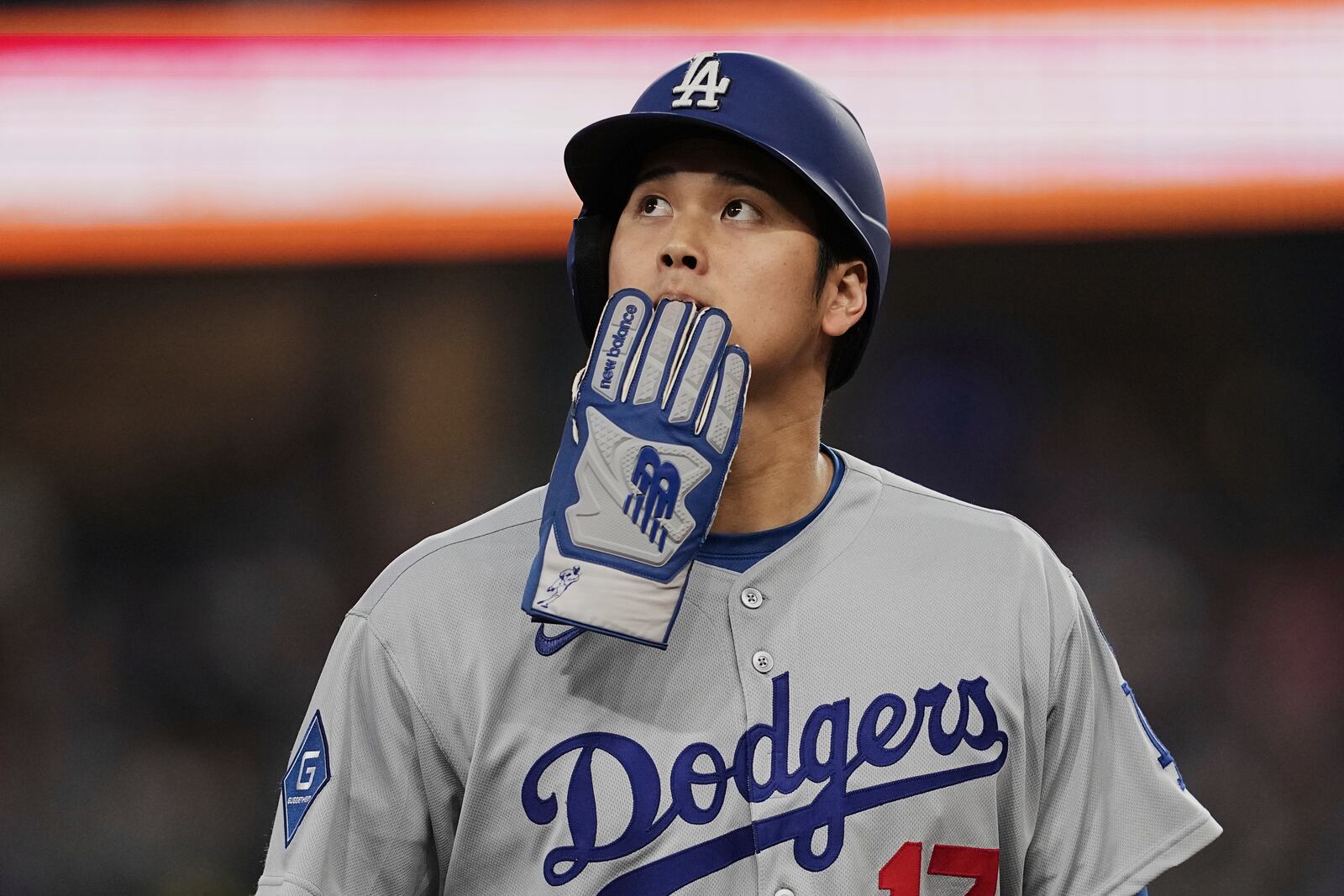 Los Angeles Dodgers' Shohei Ohtani walks off the field and to the dugout after a Teoscar Hernandez fly out in the eighth inning of a baseball game against the Texas Rangers in Arlington, Texas, Sunday, April 20, 2025. (AP Photo/Tony Gutierrez)