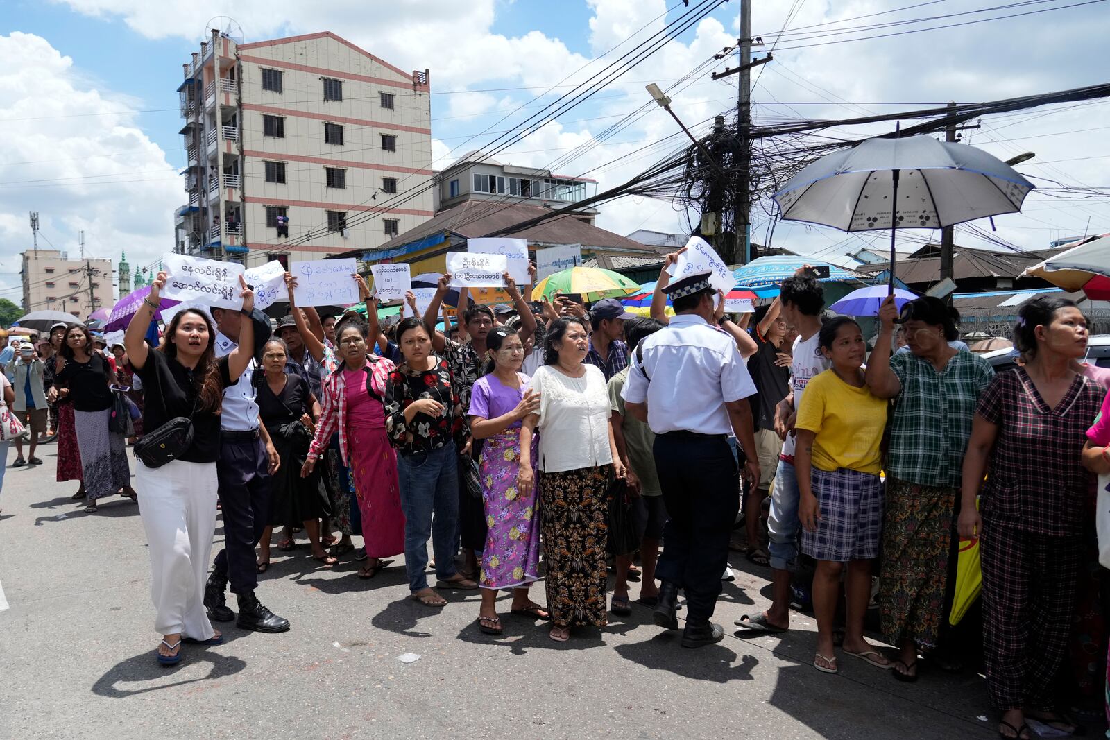 Family members and colleagues wait to welcome released prisoners outside the main gate of Insein prison as the head of Myanmar’s military government granted amnesty to thousands of prisoners to mark the country's traditional New Year Thursday, April 17, 2025, in Yangon, Myanmar. (AP Photo/Thein Zaw)