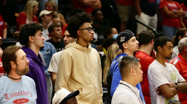 Jazz Gardner, center, a 2023 recruit, watches the Red Scare play The Money Team on Wednesday, July 27, in the third round of The Basketball Tournament at UD Arena in Dayton. David Jablonski/Staff