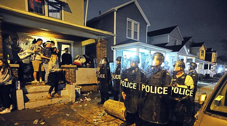 In 2020, University of Dayton Police and city of Dayton police dispersed a large crowd of “disorderly” students during a street party where about 1,000 students gathered. Authorities say students threw bottles and damaged vehicles during the incident. MARSHALL GORBY/ STAFF