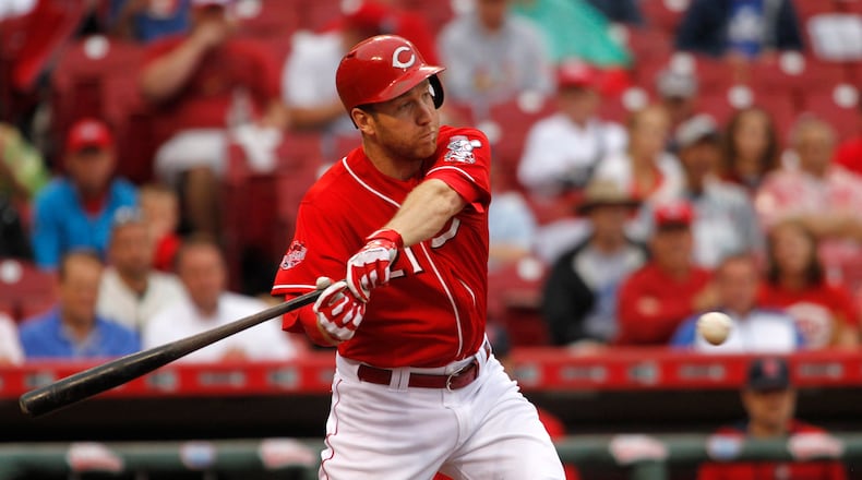 The Reds' Todd Frazier swings at a ball against the Cardinals on Thursday, Aug. 6, 2015, at Great American Ball Park in Cincinnati. David Jablonski/Staff