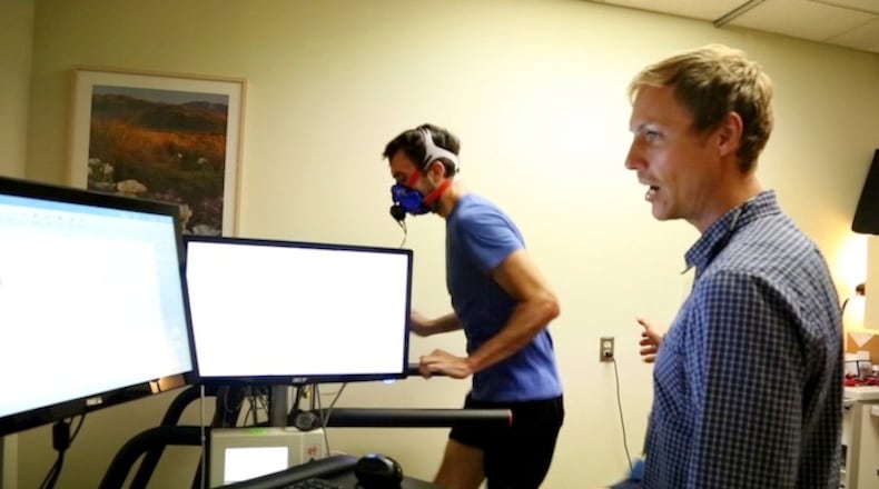 Dr. Mikael Mattsson, the lead investigator for the ELITE study, monitors the workout of Mikal Davis, a national-class duathlete from Redwood City at Stanford Medical Center in Stanford, Calif. on April, 25, 2017. Mattsson uses the treadmill test to identify athletes with freakishly high VO2 max scores, which indicate superior cardiovascular function. (Courtney Cronin/Bay Area News Group/TNS)