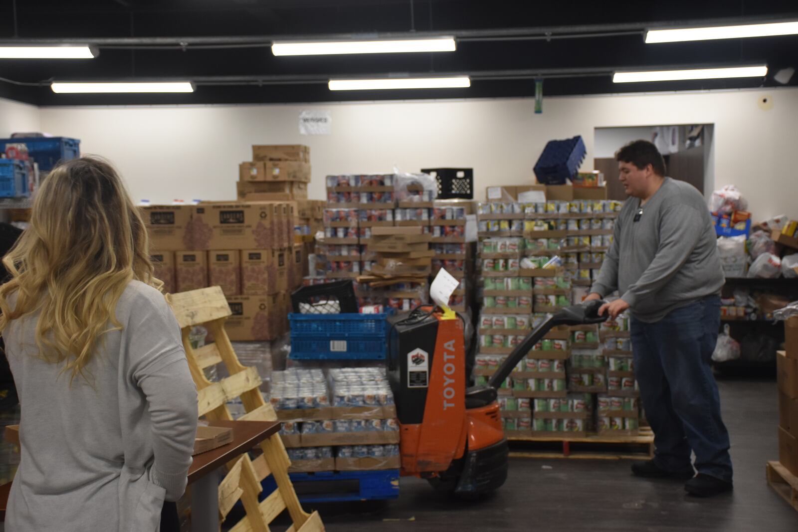 Palates of donated food at the Good Neighbor House in Dayton. CORNELIUS FROLIK / STAFF