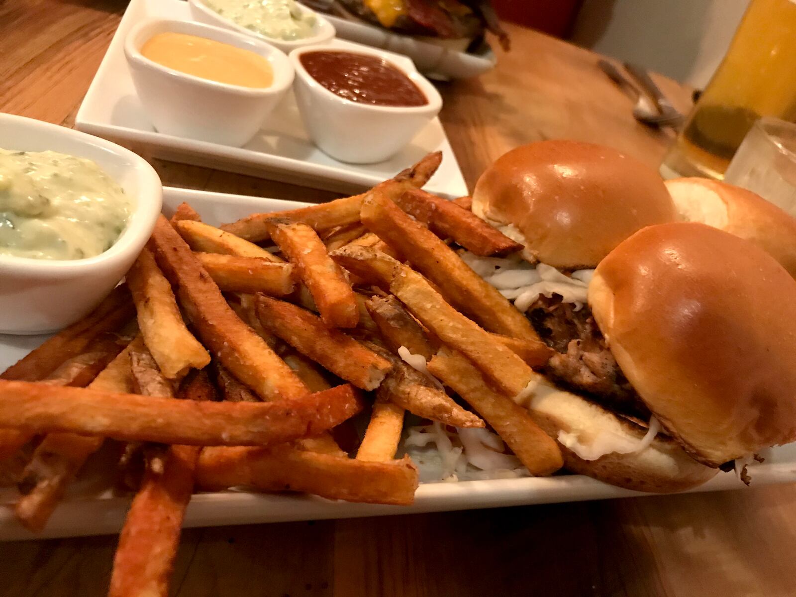The food at Lock 27 in downtown Dayton.  Pictured: Lock 27's Asian Pork Sliders served with French fries. Photo by Amelia Robinson