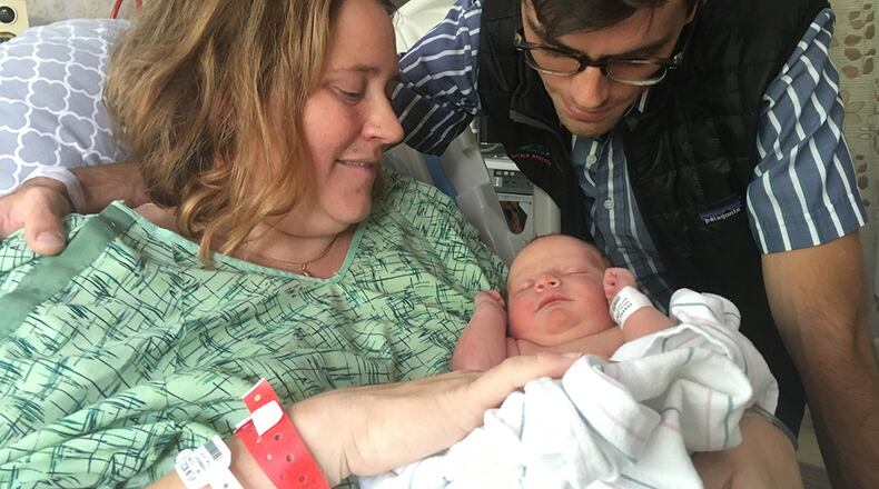 Nicole and Ben Veum and baby Adrian, who was born after Nicole had to be evacuated from a hospital because of a fire that swept through Santa Rosa, Calif. (April Dembosky/KQED/Kaiser Health News/TNS)