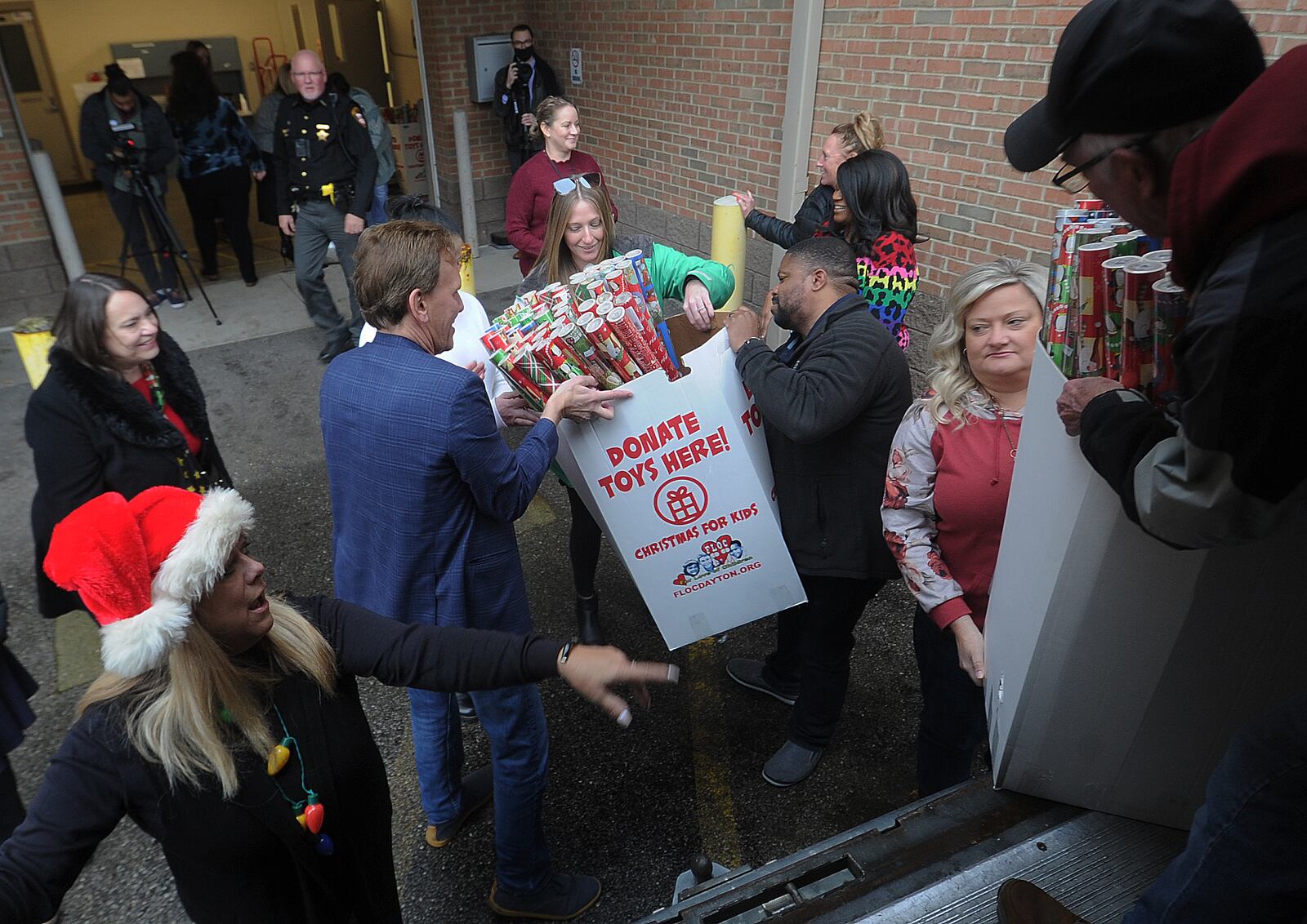For Love of Children (FLOC) delivered Christmas wrapping paper and gifts to the Haines Children’s Center Wednesday, Dec. 14, 2022 for nearly 2,000 kids working with Montgomery County Children Services. MARSHALL GORBY\STAFF
