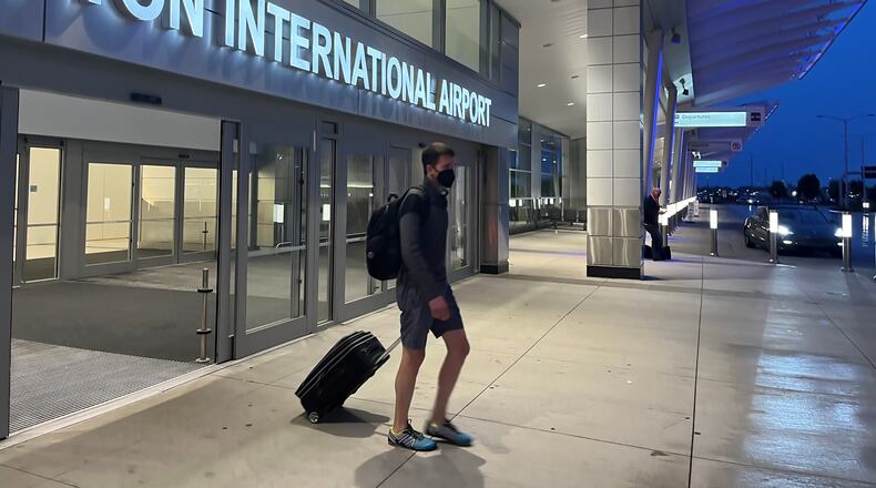 A passenger exits the Dayton International Airport. CORNELIUS FROLIK / STAFF
