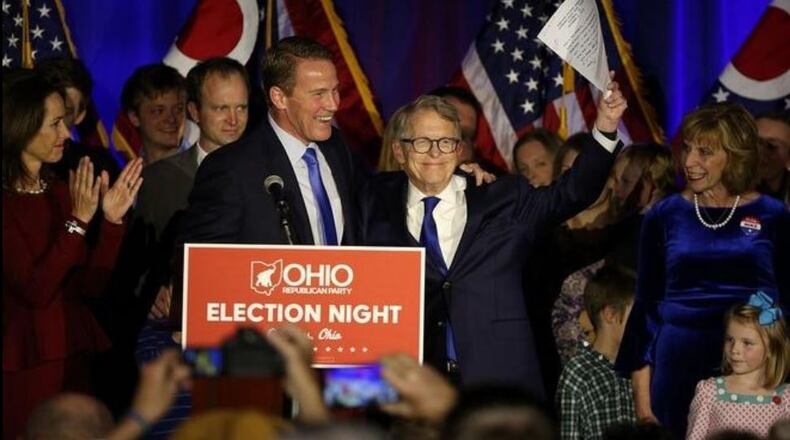 Governor-elect Mike DeWine and Lieutenant Governor-elect Jon Husted take the stage on election night at the GOP celebration at the Sheraton Hotel on Capitol Square Tuesday. Jonathan Quilter/The Columbus Dispatch