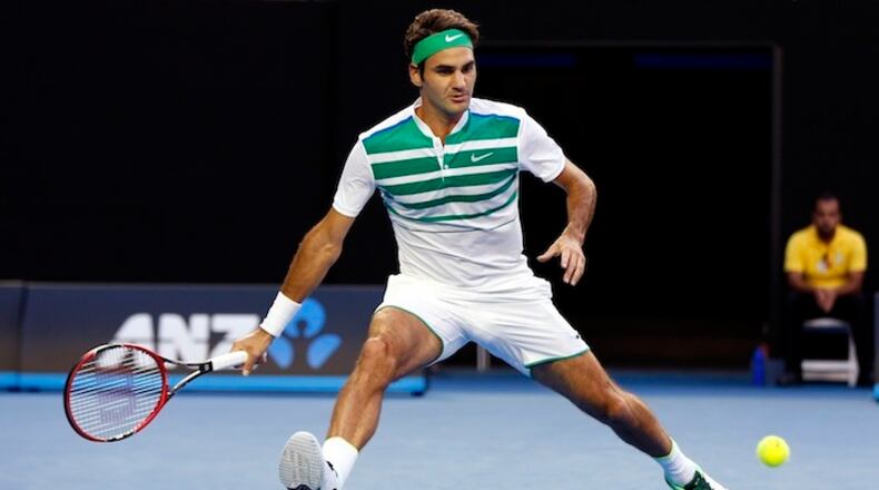 Roger Federer of Switzerland prepares to play a forehand return to Nikoloz Basilashvili of Georgia during their first round match at the Australian Open tennis championships in Melbourne, Australia, Monday, Jan. 18, 2016.(AP Photo/Vincent Thian)
