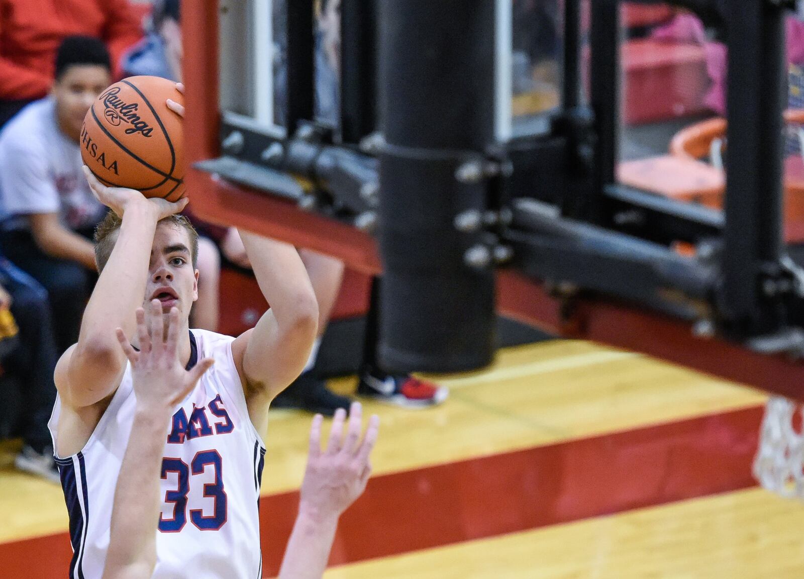 Miami Valley’s Casey Gossett keeps his eye on the basket during Thursday night’s Brian Cook Classic opener against host Madison. NICK GRAHAM/STAFF