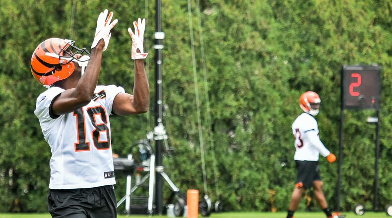 Bengals’ wide receiver A.J. Green catches a pass during organized team activities Tuesday, May 22 at the practice facility near Paul Brown Stadium in Cincinnati. NICK GRAHAM/STAFF