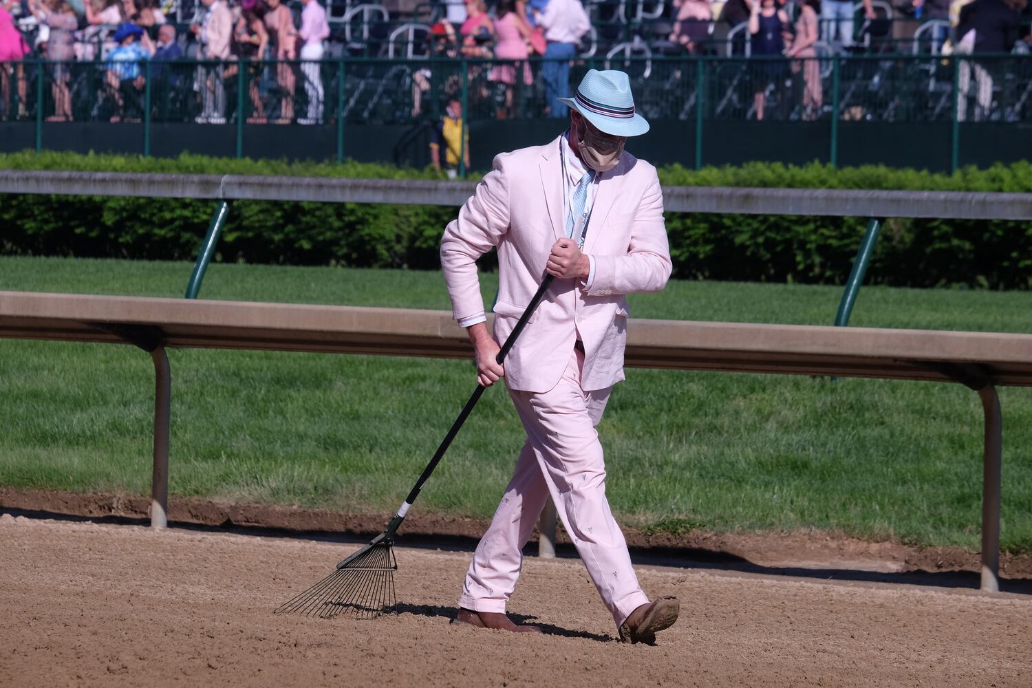 The track is raked on Friday, April 30, 2021, at Churchill Downs in Louisville, Ky., after a Kentucky Oaks race. (Christian Hansen/The New York Times)