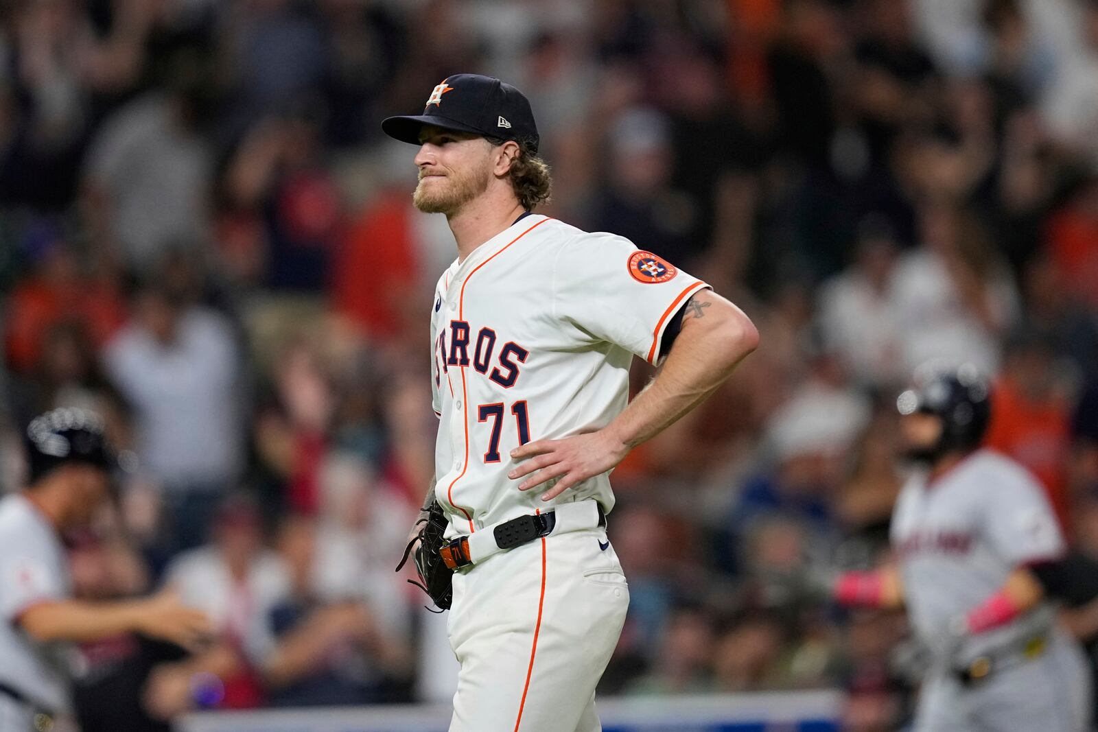 Houston Astros pitcher Josh Hader (71) reacts after giving up a grand slam to Cleveland Guardians' Angel Martínez during the 10th inning of a baseball game Tuesday, July 8, 2025, in Houston. (AP Photo/David J. Phillip)