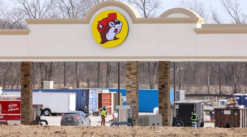 Construction continues on Buc-ee's on Ohio 235 in Huber Heights near the Interstate 70 interchange. Huber Heights Mayor Jeff Gore announced earlier this week the megastore would open on April 6. Work on the westbound I-70 exit ramp to Ohio 235 is nearing completion, as is work on the 235 bride that spans I-70. BRYANT BILLING/STAFF