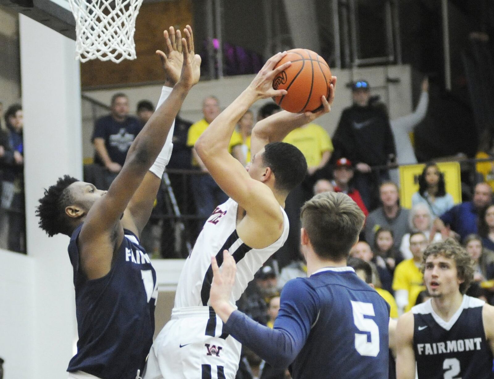 DaShawn Brown of Fairmont (left) confronts Brian Hill (with ball) of Wayne. Fairmont defeated Wayne 51-43 in a boys high school basketball D-I sectional final at Centerville on Monday, March 4, 2019. MARC PENDLETON / STAFF