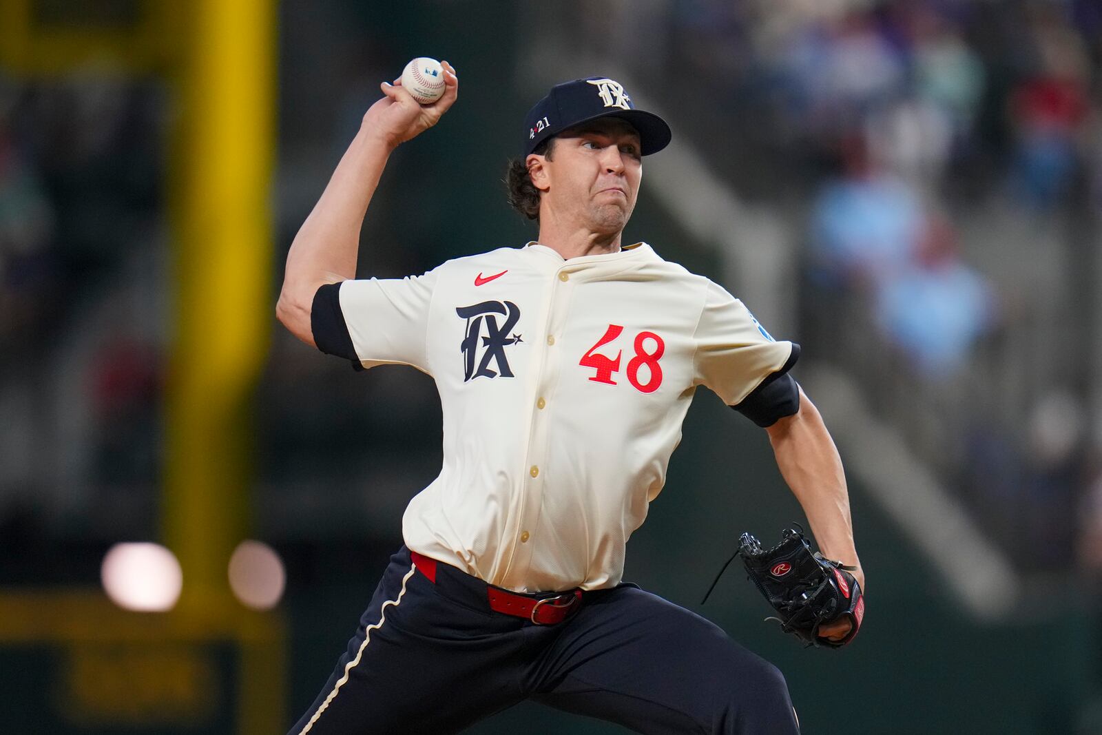 Texas Rangers starting pitcher Jacob deGrom throws a pitch to the Los Angeles Dodgers during the first inning of a baseball game Friday, April 18, 2025, in Arlington, Texas. (AP Photo/Julio Cortez)
