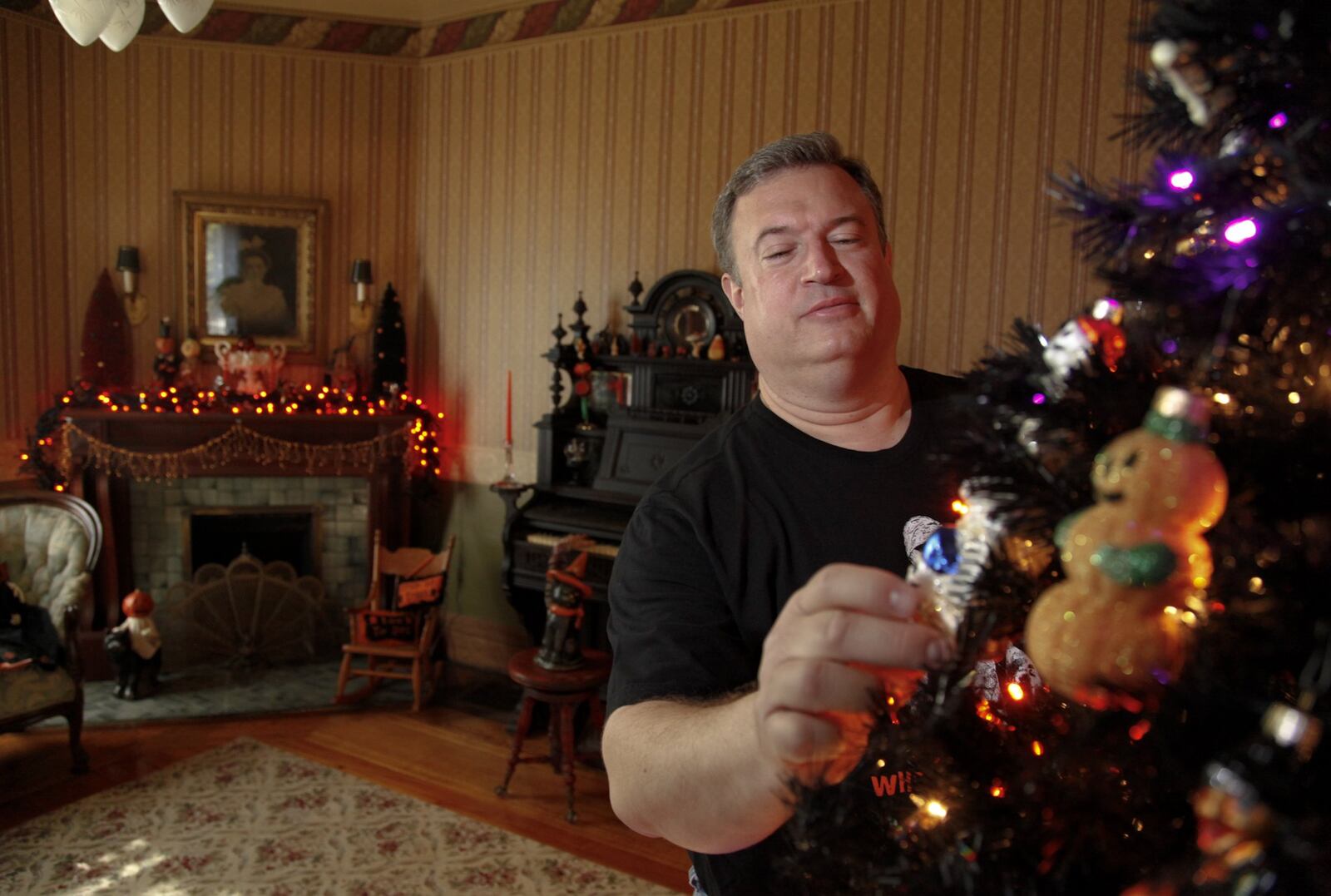 Dan Livesay of Dayton decorates a Halloween themed tree in his Huffman Historic Area home in preparation for The Spirit of Huffman Historic Home Tour. Eight historic homes decorated in the spirit of Halloween will be on the tour which will be held Saturday from 2-5 p.m and Sunday from 2-8 p.m. Tickets are $5 in advance and $7 the day of the tour. On Sunday guided tours will also be available from 6-8 p.m. Guided tours are $10 in advance and $15 the day of. Tour day tickets will be available at 54 Linden Ave. or tickets can be ordered in advance at www.historichuffman.org.
