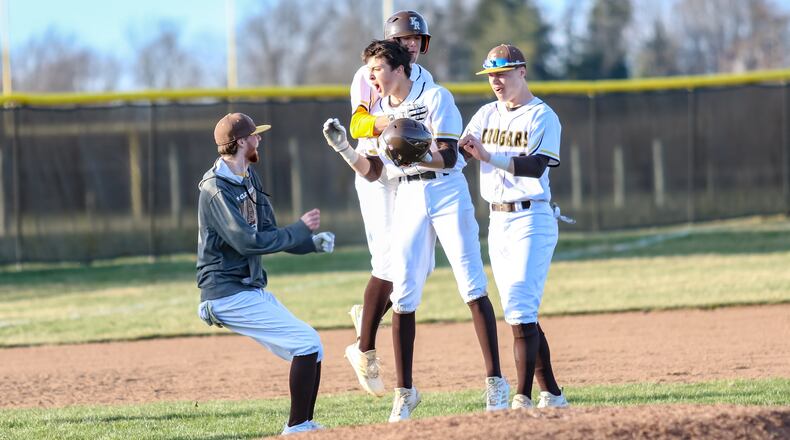 Kenton Ridge senior Chase Marrs celebrates with his teammates. CONTRIBUTED PHOTO BY MICHAEL COOPER