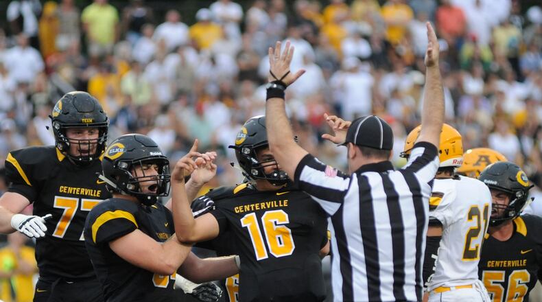 Freshman QB Chase Harrison (16) and teammates celebrate his TD. Alter defeated host Centerville 10-7 in a Week 3 high school football game on Friday, Sept. 7, 2018. MARC PENDLETON / STAFF