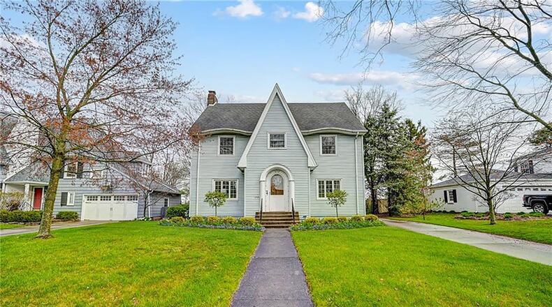 The front of the home has updated siding, an oval front entry door and a two-car detached garage with opener. CONTRIBUTED PHOTOS