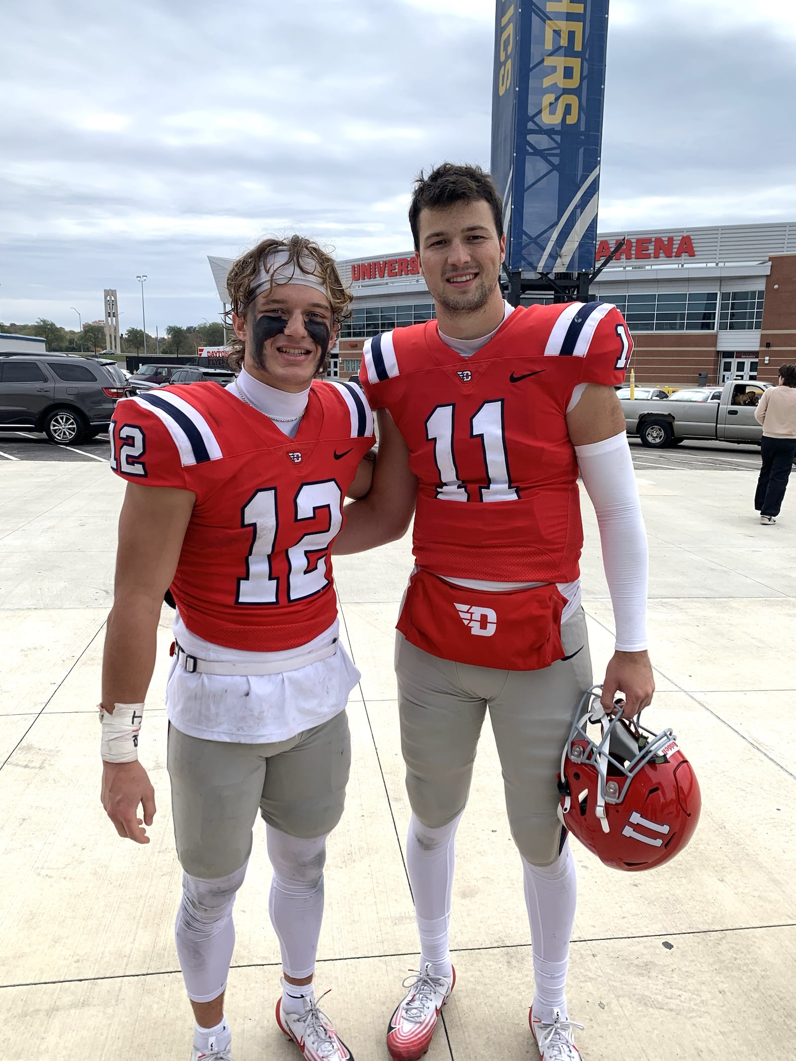 After Saturday’s game, Gavin Lochow and Drew VanVleet, two of the heroes of the Dayton Flyers 35-19 victory over previously unbeaten Presbyterian College pose for their families’ cameras outside the Welcome Stadium dressing room. Both are sons of former Dayton Flyers standout players. Lochow, normally a wide receiver, often played quarterback Saturday. He rushed 17 times for 133 yards and two touchdowns. He also caught five passes from VanVleet, the starting quarterback, who would move to receiver when they switched positions, VanVleet completed 10 of 12 passes for 104 yards and a touchdown. CONTRIBUTED PHOTO