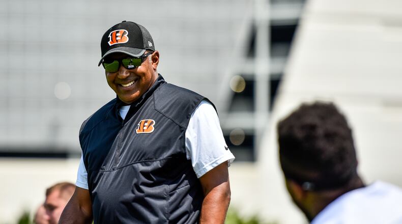 Head Coach Marvin Lewis smiles at a player during the first day of Cincinnati Bengals Training Camp Friday, July 28 at the practice fields beside Paul Brown Stadium in Cincinnati. NICK GRAHAM/STAFF