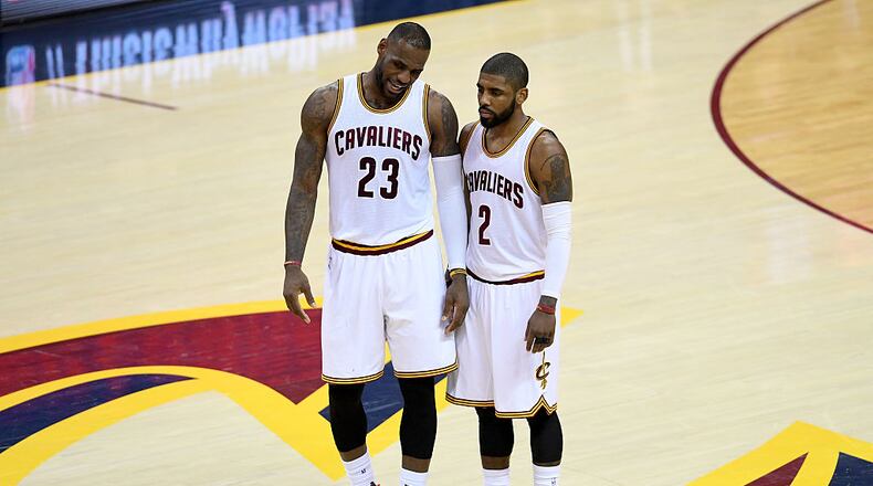 CLEVELAND, OH - MAY 17: LeBron James #23 and Kyrie Irving #2 of the Cleveland Cavaliers talk at mid court in the first half against the Toronto Raptors in game one of the Eastern Conference Finals during the 2016 NBA Playoffs at Quicken Loans Arena on May 17, 2016 in Cleveland, Ohio. NOTE TO USER: User expressly acknowledges and agrees that, by downloading and or using this photograph, User is consenting to the terms and conditions of the Getty Images License Agreement. (Photo by Jason Miller/Getty Images)