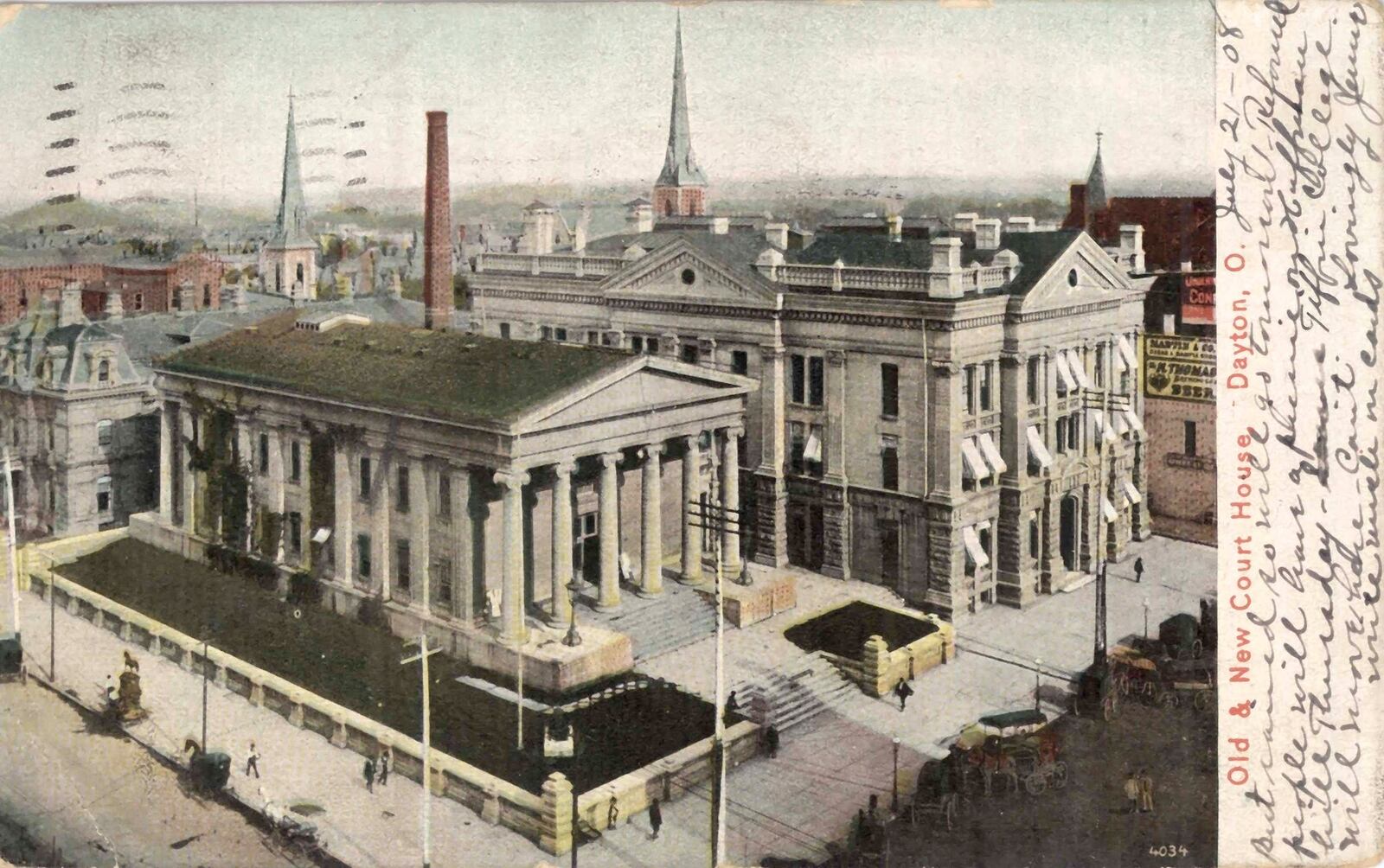 A postcard with an image of the Old and New Courthouses in downtown Dayton is part of the Dayton Metro Library Collection. This card has a hand written greeting and post marks on the front. DAYTON METRO LIBRARY