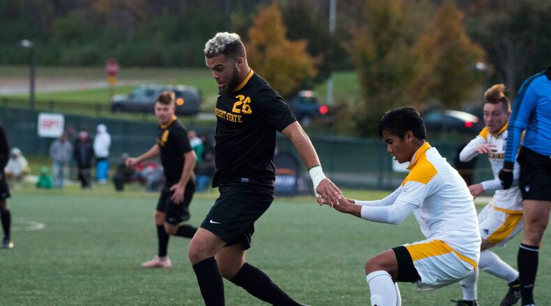 Wright State’s Austin Kinley (26) shields a Milwaukee defender from the all during last week’s Horizon League semifinal at Alumni Field. Joseph Craven/CONTRIBUTED