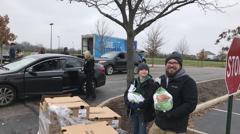 Volunteers pick up turkeys from Bogg Ministries at SouthBrook Christian Church in Miamisburg. Volunteers delivered around 1,000 turkeys to families in need last weekend so that they can have a meal on Thanksgiving.