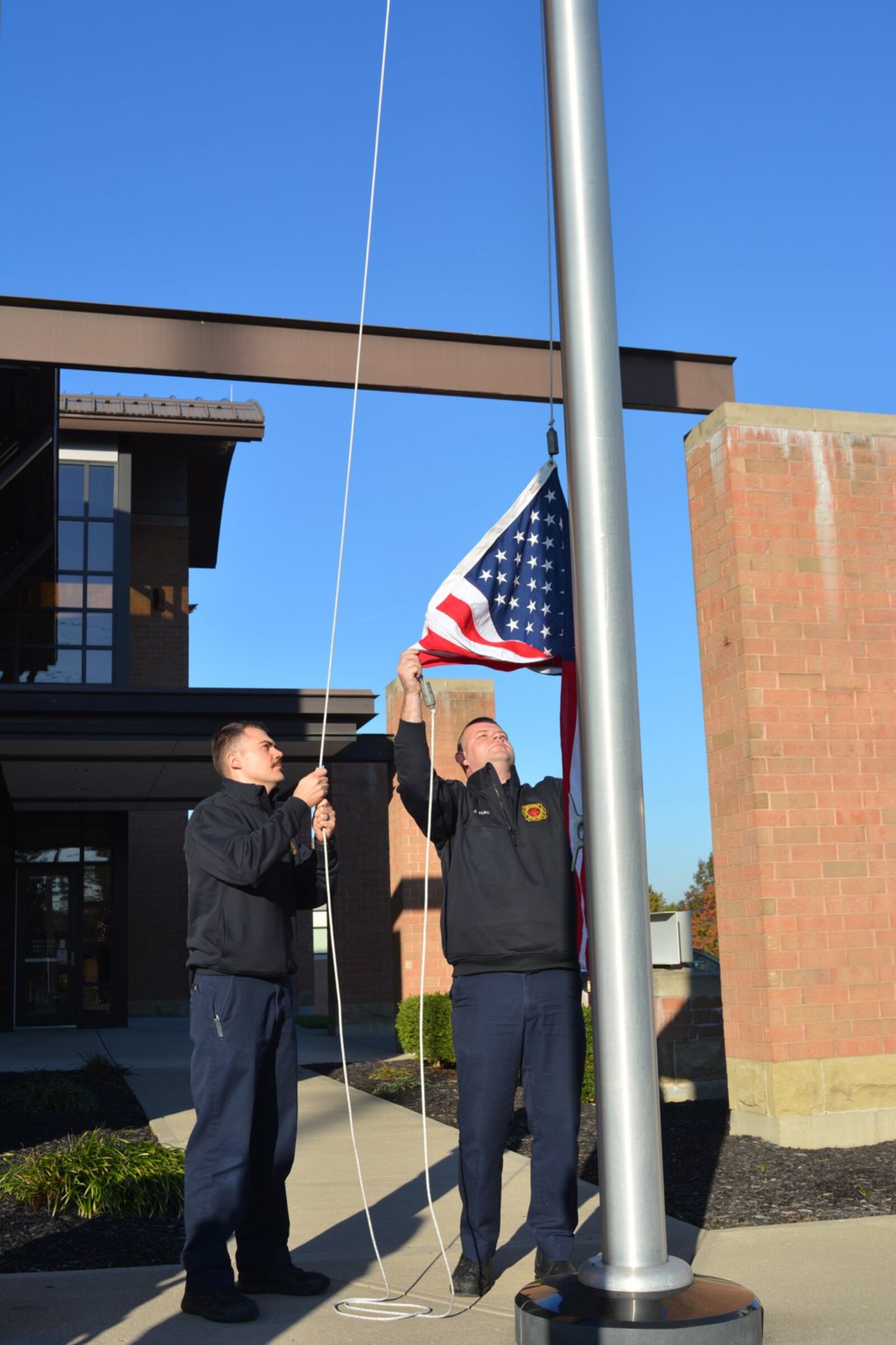 A flag flown by West Chester Twp. in 2017 could be visible on the podium with U.S. athletes  during the Winter Olympics in Pyeongchang, South Korea. The flag, part of the Team USA Bobsled and Skeleton American Flag First Responders Relay, flew at West Chester Fire Headquarters Oct. 26, where the honor guard was present for a brief ceremony. CONTRIBUTED
