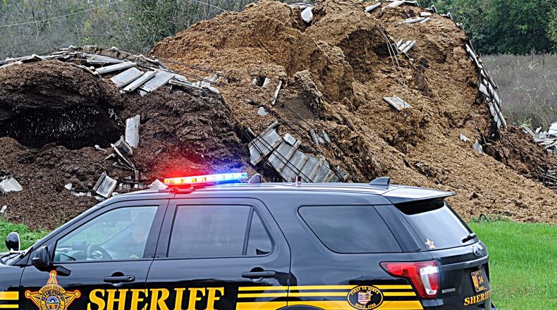 A silo collapsed Thursday at Miami Valley Feed and Grain Company on West Jefferson Street in New Carlisle, marking the second time such an incident has happened at the business this year. Firefighters said the silo was holding grain waste. MARSHALL GORBY / STAFF