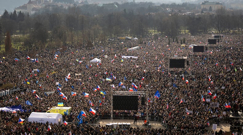 People gather to take part in a large anti-government protest in Prague, Czech Republic, Saturday, March 21, 2026. (AP Photo/Michal Turek)