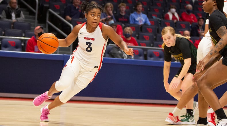 Dayton's Makira Cook drives baseline against Wright State during a game at UD Arena earlier this season. Cook scored a career-high 29 points in Saturday's win over George Mason. Jeff Gilbert/CONTRIBUTED