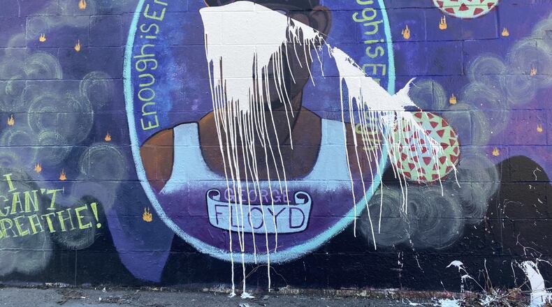 White paint was splattered over a George Floyd mural in Yellow Springs sometime on Sunday night, said Yellow Springs Police Chief Brian Carlson. EILEEN McCLORY STAFF