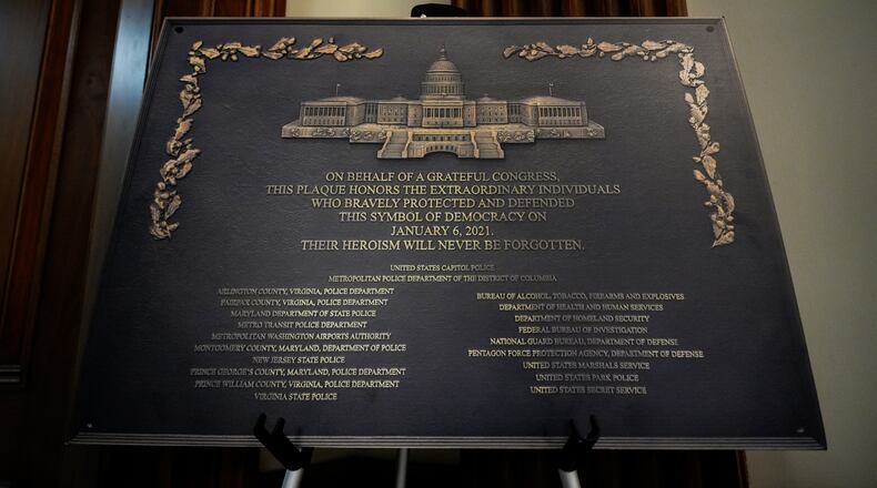 A replica plaque commemorating the Jan. 6, 2021 Capitol riot stands outside the office of House Minority Leader Hakeem Jeffries, D-N.Y, Tuesday, Dec. 30, 2025, at the U.S. Capitol in Washington. (AP Photo/Julia Demaree Nikhinson)