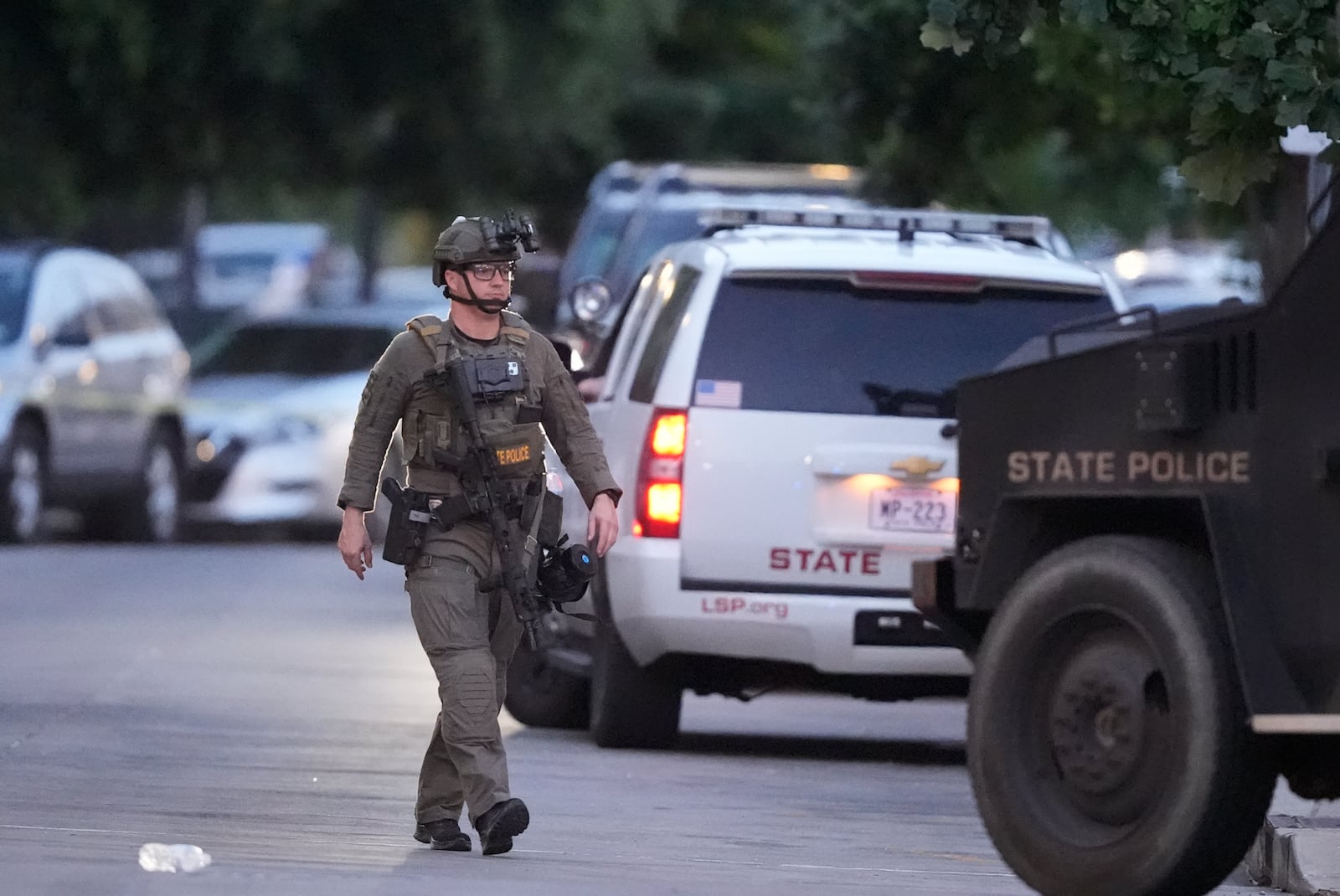 FILE - A Louisiana state police SWAT member works the scene on Iberville Street as police pursue a fugitive that escaped from a New Orleans jail, Tuesday, May 20, 2025, in New Orleans. (AP Photo/Gerald Herbert, File)