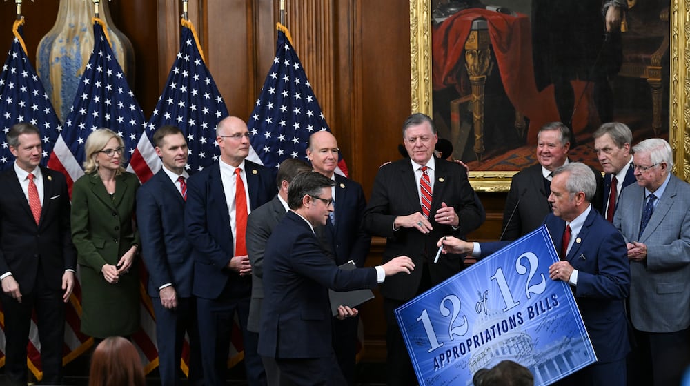 House Speaker Mike Johnson (R-La.) goes to sign a poster at a news conference about the passage of appropriations bills at the Capitol in Washington, on Thursday, Jan. 22, 2026. The House on Thursday passed legislation to fund a broad swath of the government including the Department of Homeland Security, narrowly mustering the votes amid a Democratic revolt over spending for Immigration and Customs Enforcement. (Kenny Holston/The New York Times)