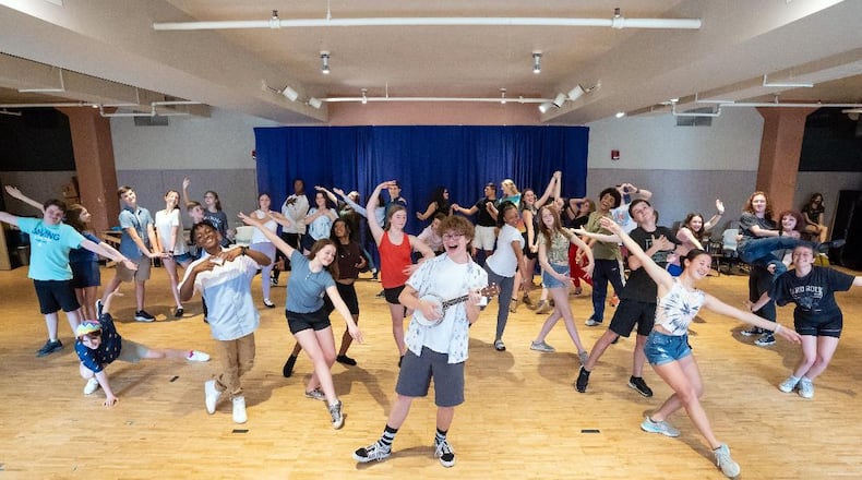 Griffin Greear (center as Uncle Fester Addams) and cast in rehearsal for the Muse Machine's production of "The Addams Family," slated June 17-19. PHOTO BY MATT SILVER
