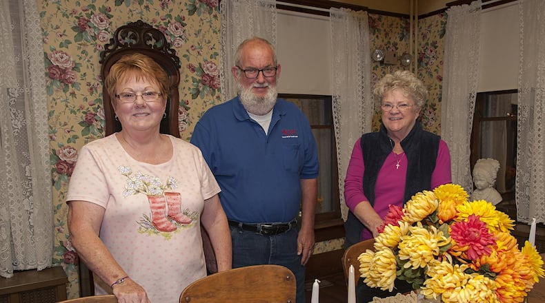Dolly McKeehan (left), Milton Cook and Linda Morgan are among the volunteer staff at the Waynesville Museum at the Friends Home. They are pictured in the museum’s dining room. CONTRIBUTED
