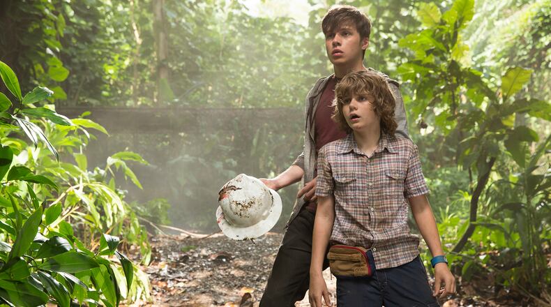 This photo provided by Universal Pictures shows, Nick Robinson, left, and Ty Simpkins in a scene from the film, "Jurassic World," directed by Colin Trevorrow, in the next installment of Steven Spielberg's groundbreaking "Jurassic Park" series. The 3D movie releases in theaters by Universal Pictures on June 12, 2015. (Chuck Zlotnick/Universal Pictures via AP)
