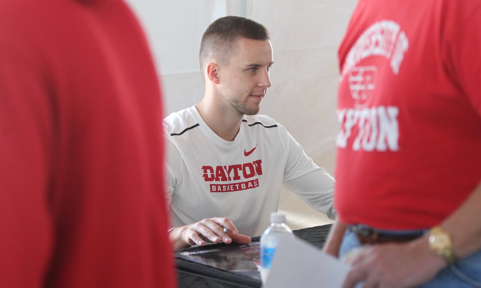 Dayton’s Matej Svoboda signs autographs at a basketball fan fest on Saturday, Oct. 14, 2017, at Welcome Stadium in Dayton.