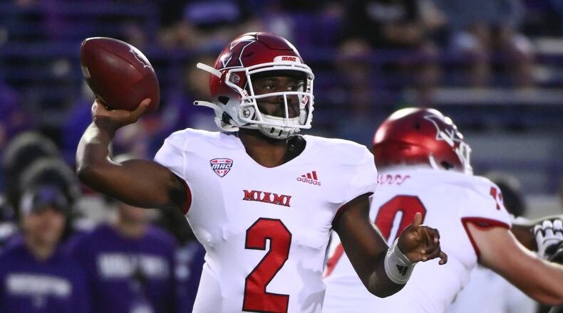 Miami (Ohio) quarterback Aveon Smith looks for a receiver during the first half of the team's NCAA college football game against Northwestern on Saturday, Sept. 24, 2022, in Evanston, Ill. (AP Photo/Matt Marton