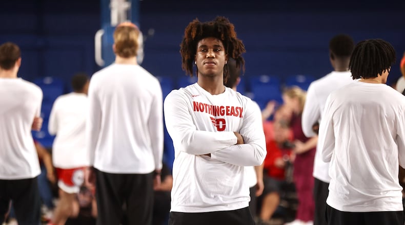 Dayton's Marvel Allen watches the team warm up before a NIT game against Florida Atlantic on March 20, 2025, in Boca Raton, Fla. David Jablonski/Staff
